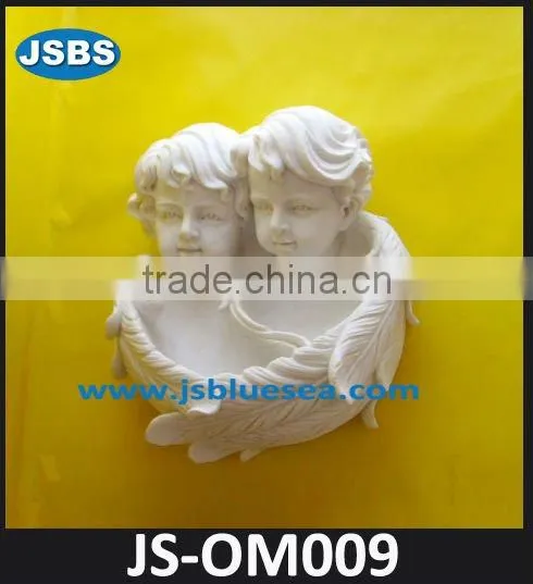 Polished marble nude lady statue in wall