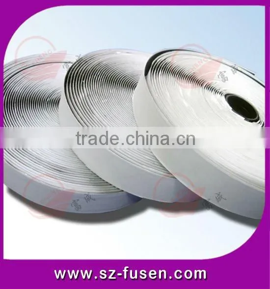 Adhesive hook and loop roll in black/white color