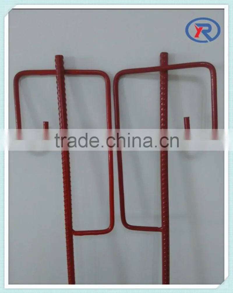 red painted steel picket fence post