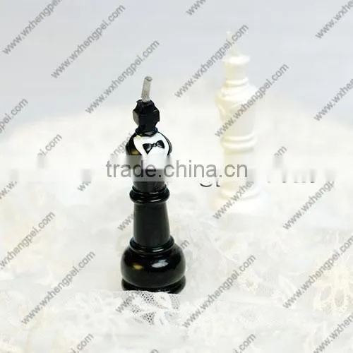 Wedding candles on the chess king and queen