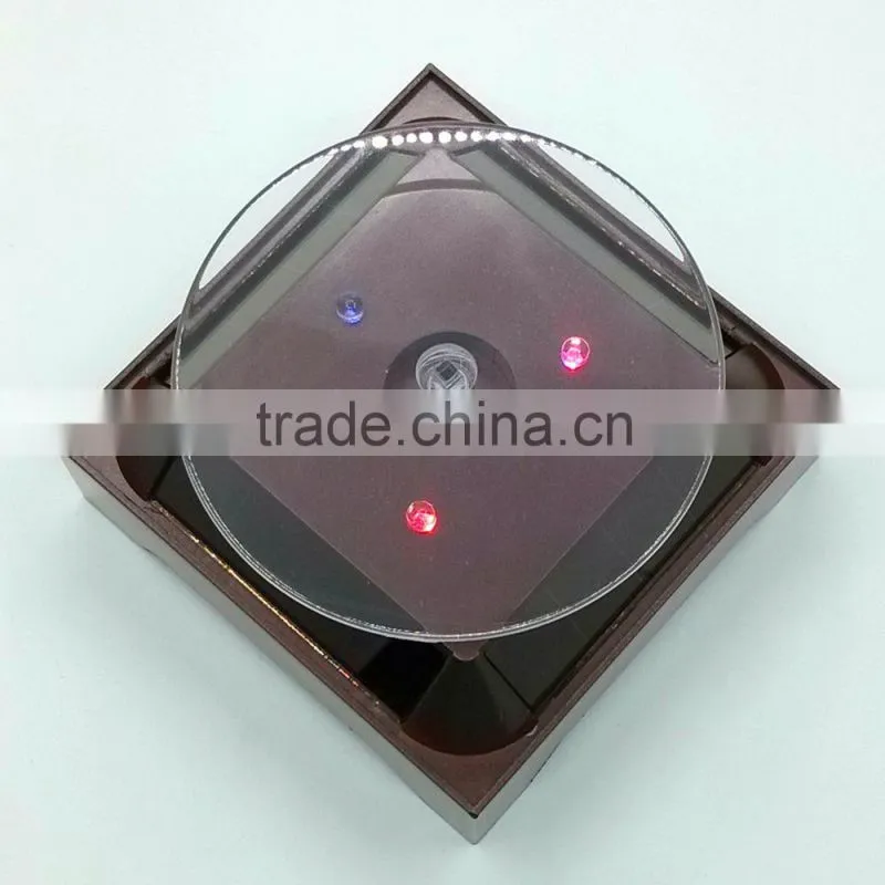 2015 New solar power rotating display stand for iphone 6 plus
