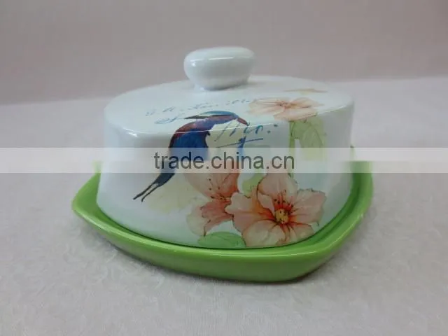 a set of small ceramic coffee cup with green saucer