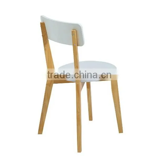 white solid wooden round dining table