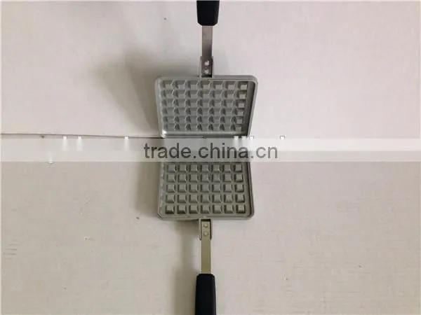 aluminum die cast non stick waffle iron maker on camp fire