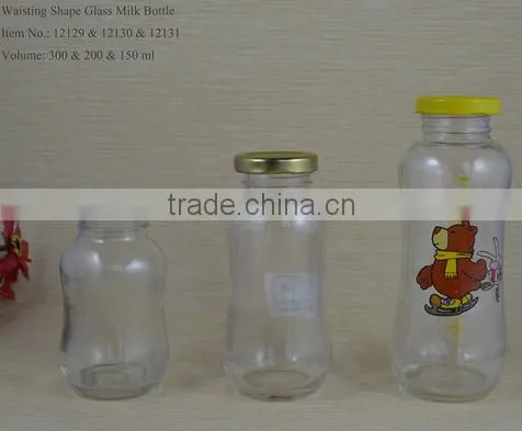Glass baby bottle with red cap