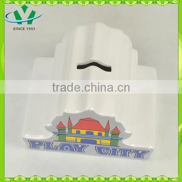 Ceramic piggy bank counting money castle house