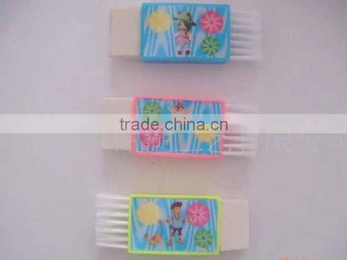 Plastic sharpener with eraser and brush