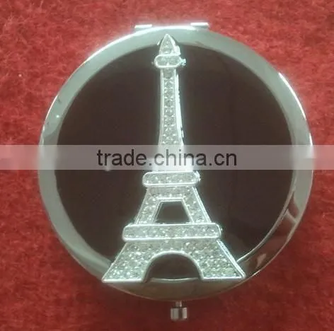 round compact mirror with decorative Eiffel Tower decor