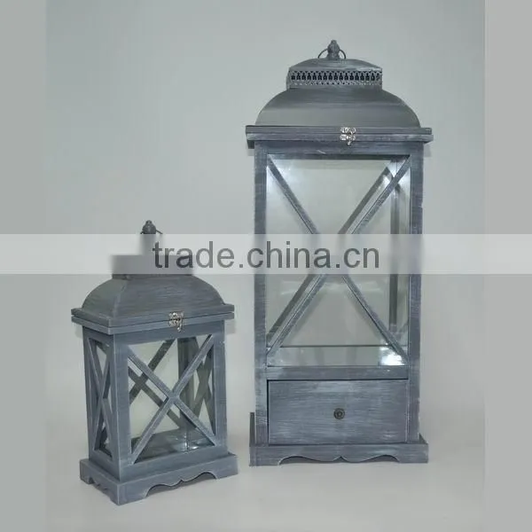 Brown wooden candle lantern with drawers