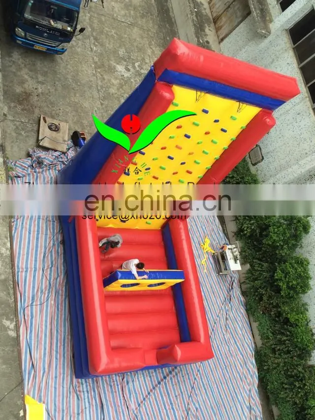 Inflatable climbing wall with obstacle course