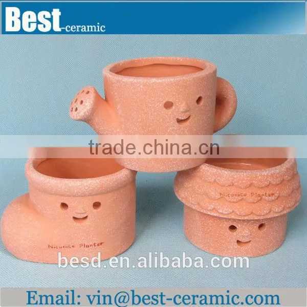 face design terracotta unglazed ceramic flower pot