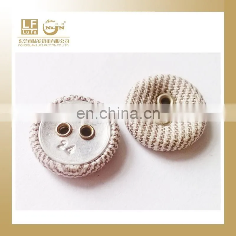 Fabric covered button or leather button