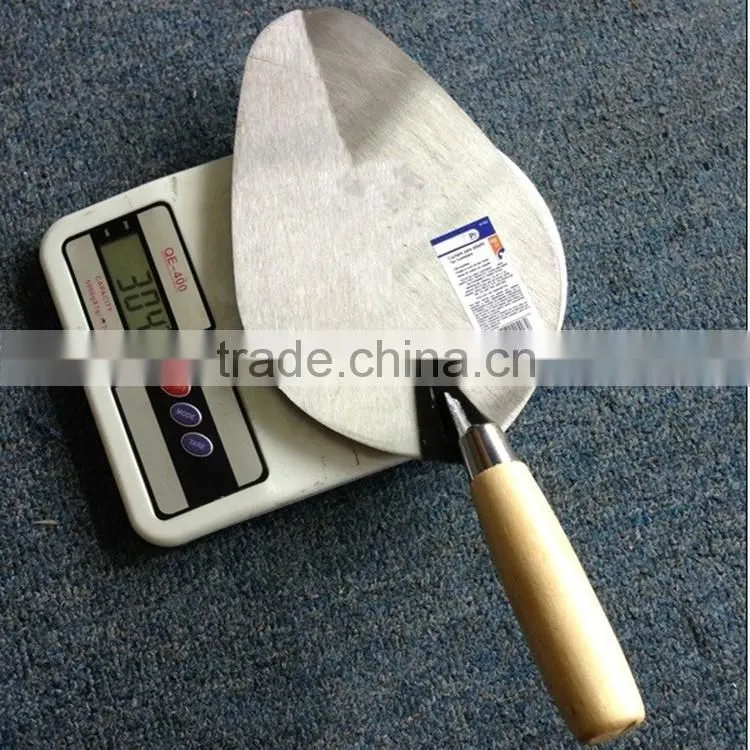 Professional construction tools brick with wood handle trowel