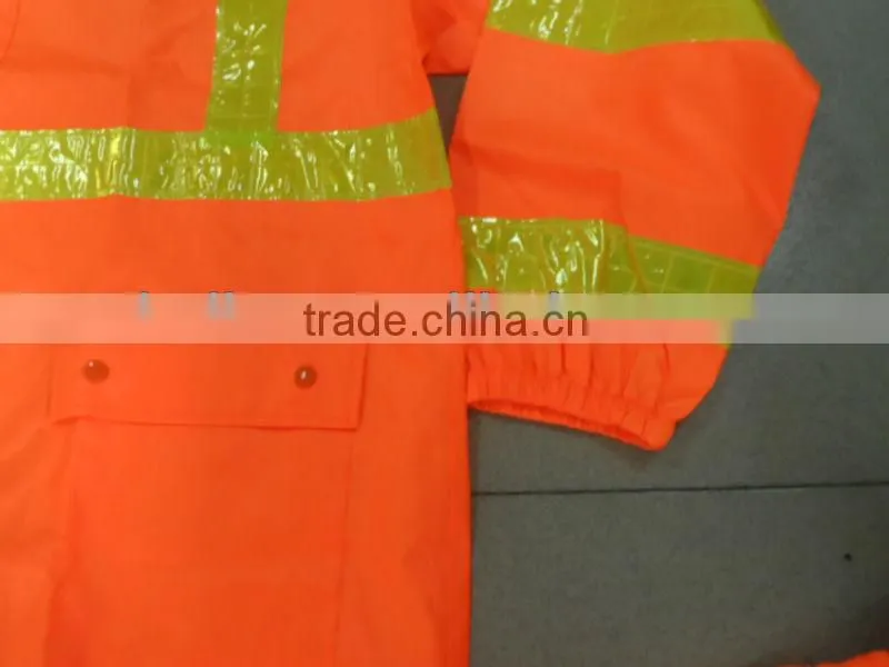 high visibility orange safety rainsuit with yellow plastic tapes