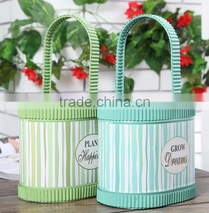 Oval colour painted metal flower planter with handles
