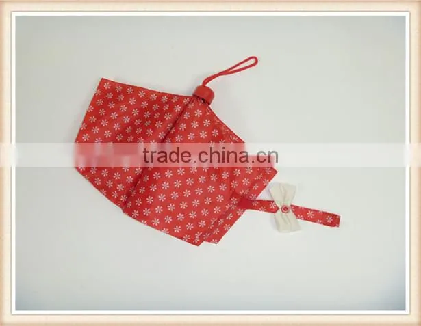 Red fold umbrella with white flower handle color match the fabric