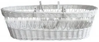 White wicker baby bassinet with cosy dressings