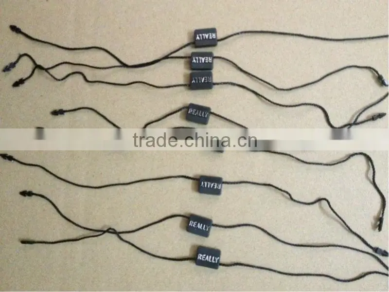 Factory custom black plastic hang tag/string seal with logo printing for sale