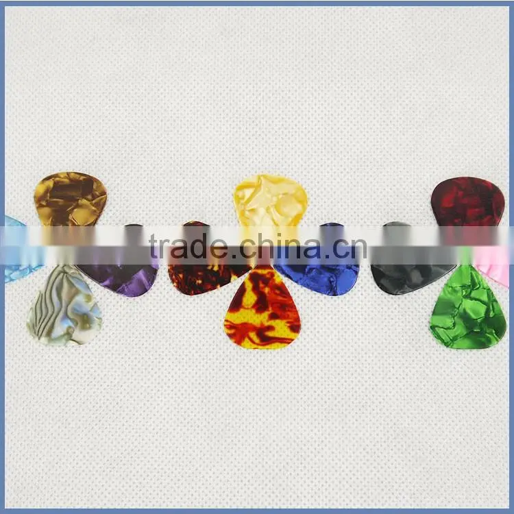 Different size guitar pick sheet material for acoustic guitar