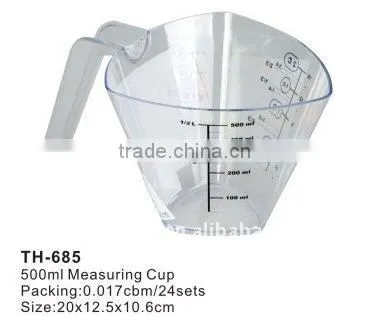 plastic measuring cup with spoons
