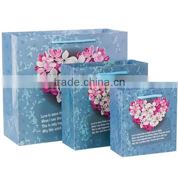 factory price blue Gift paper Packaging Bag with handlle for shopping wtih beautiful flowers