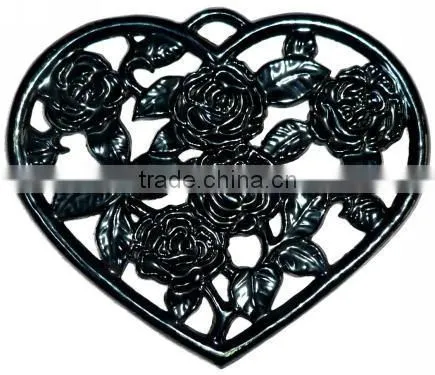 heart shape cast iron cooking trivet with flower