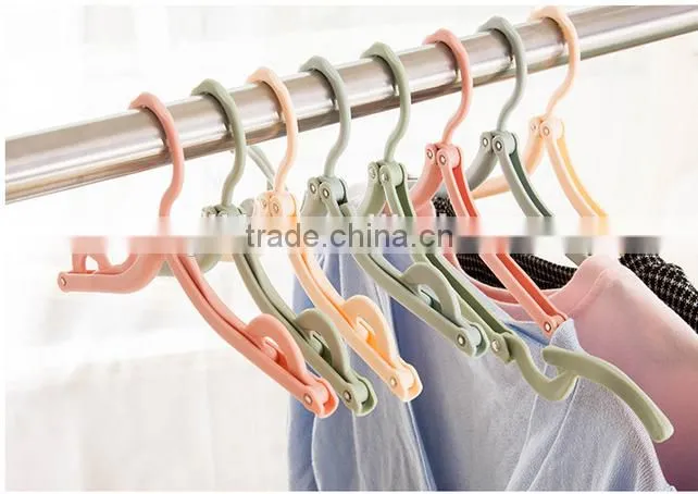 Hot selling plastic foldable travel home clothes hanger with anti-slip grooves