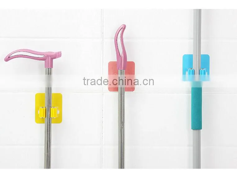 Wholesale Stock Magic Wall Suction Plastic Mop Handle Storage Holder