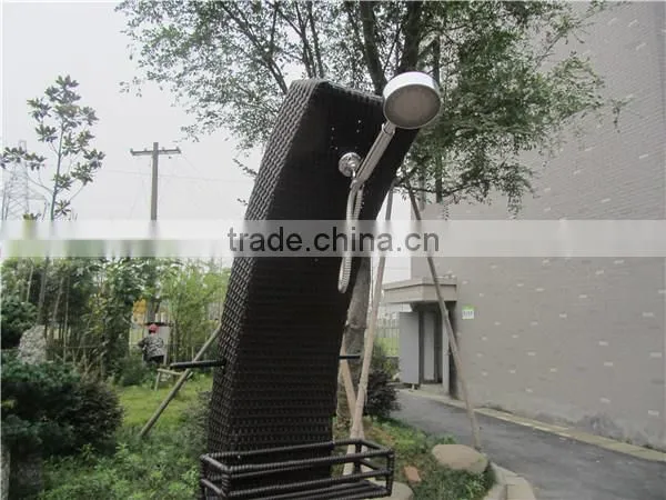 Twisted shaped rattan shower with a pulley system