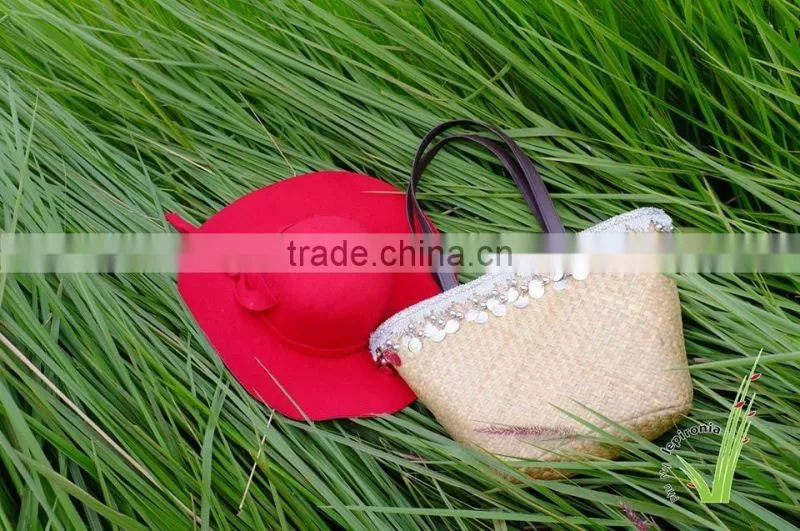 Seagrass beach bag with seashell decoration, cool design for summer holiday