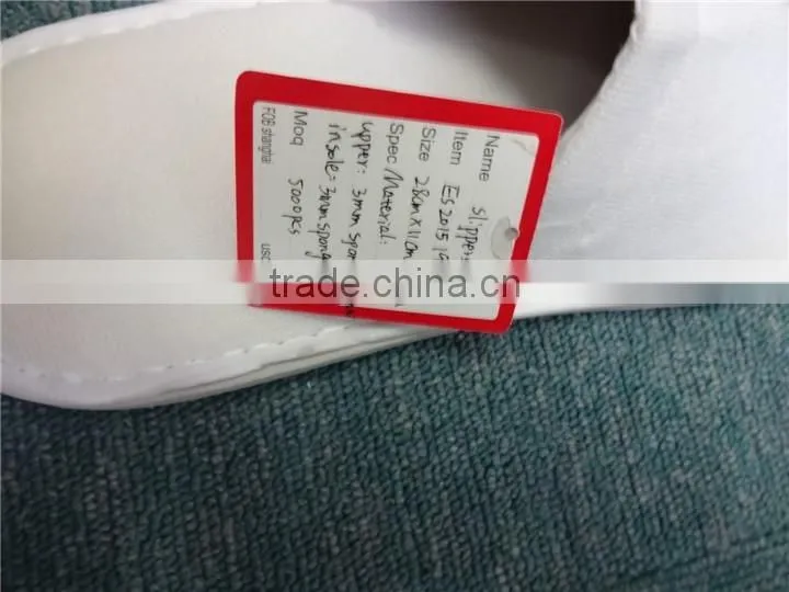 Brand new white fluffy indoor hotel bathroom slippers