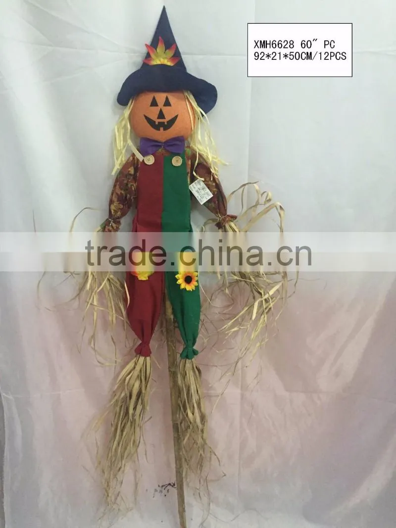Straw and fabric scarecrow witch for halloween decoration