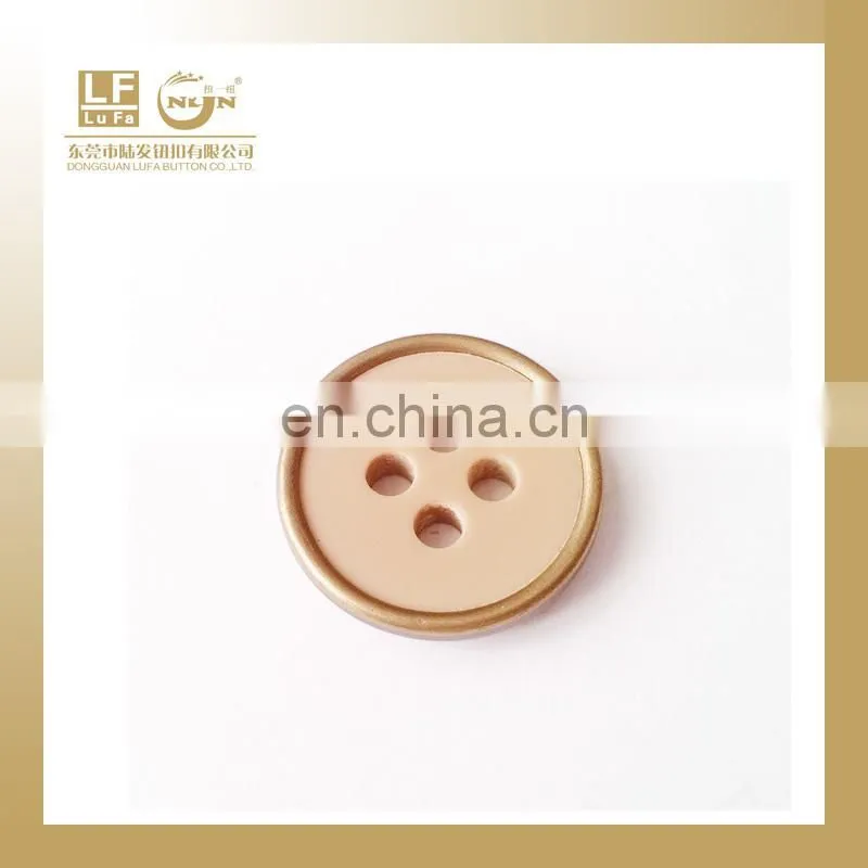 plastic button with metal rim