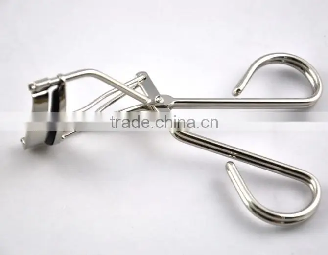 Silver colour tweezers and stainless steel eyelash curler