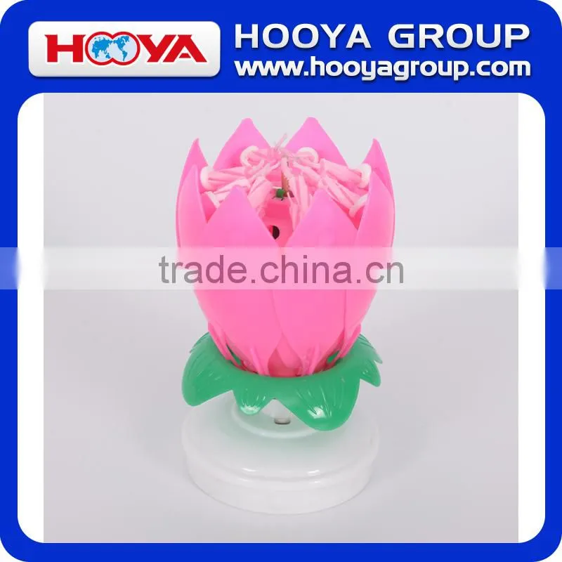 Lotus shaped rotating birthday candle with round base