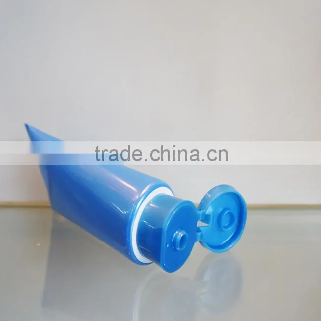 plastic tube with oriented flip-top cap