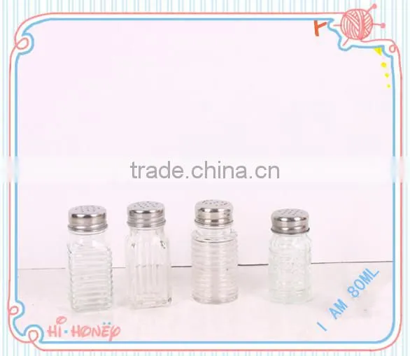 Clear glass salt and pepper shaker with metal cap