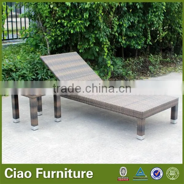 Outdoor used beach sun lounger with side table