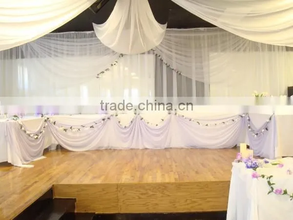 fancy and elegant pipe and drape wedding backdrop