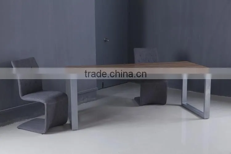 Long narrow stainless steel feet with wooden dining table