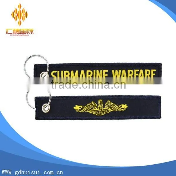 Popular design cheap customized elliptical shape embroidery personalized logo key chain