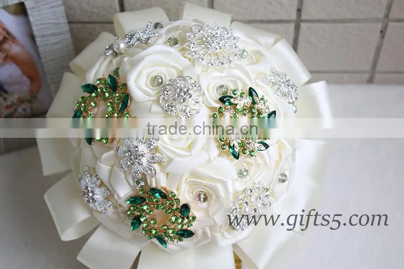 Romantic wedding bouquet full of crystal beads and green brooches