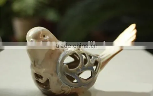Ceramic bird home decoration with hollowed out shape