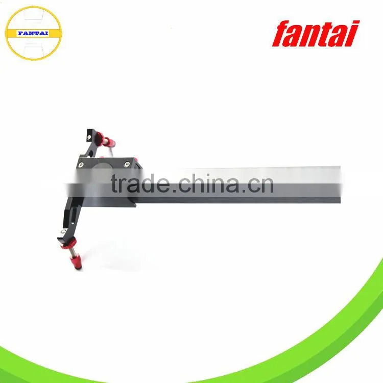 black metal video motorized camera slider with four feet