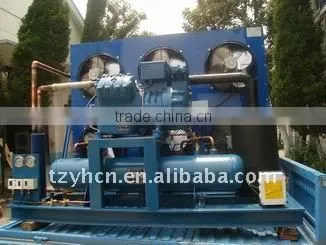Two stage piston compressor