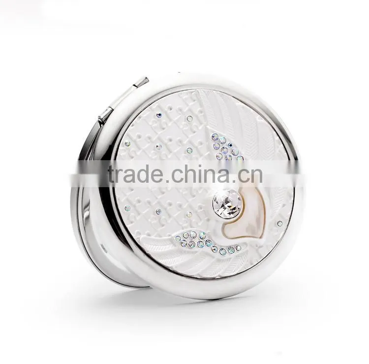 Round compact mirror fully covered with crystals on the top