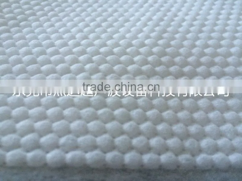 Double location for the cutting and rewinding non-woven punching machine