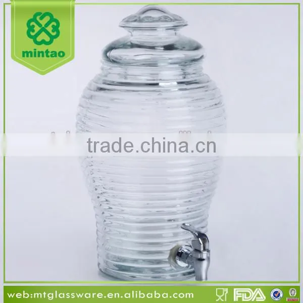 Clear machine made glass dispenser for juice beverage water with silver tap