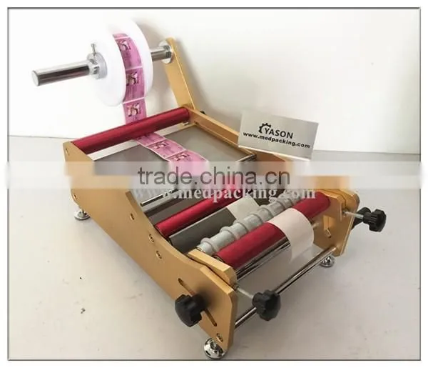 Manual Round Bottle Sticker label machine labels on round bottle/round jar/cylinder