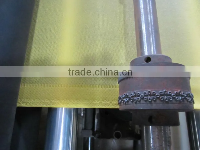 Computer Non woven roll embossed - punched - sheets cutting machine